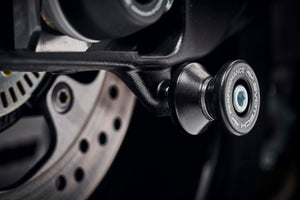 The rear wheel of the Suzuki GSX-S1000FT with EP Paddock Stand Bobbins installed.