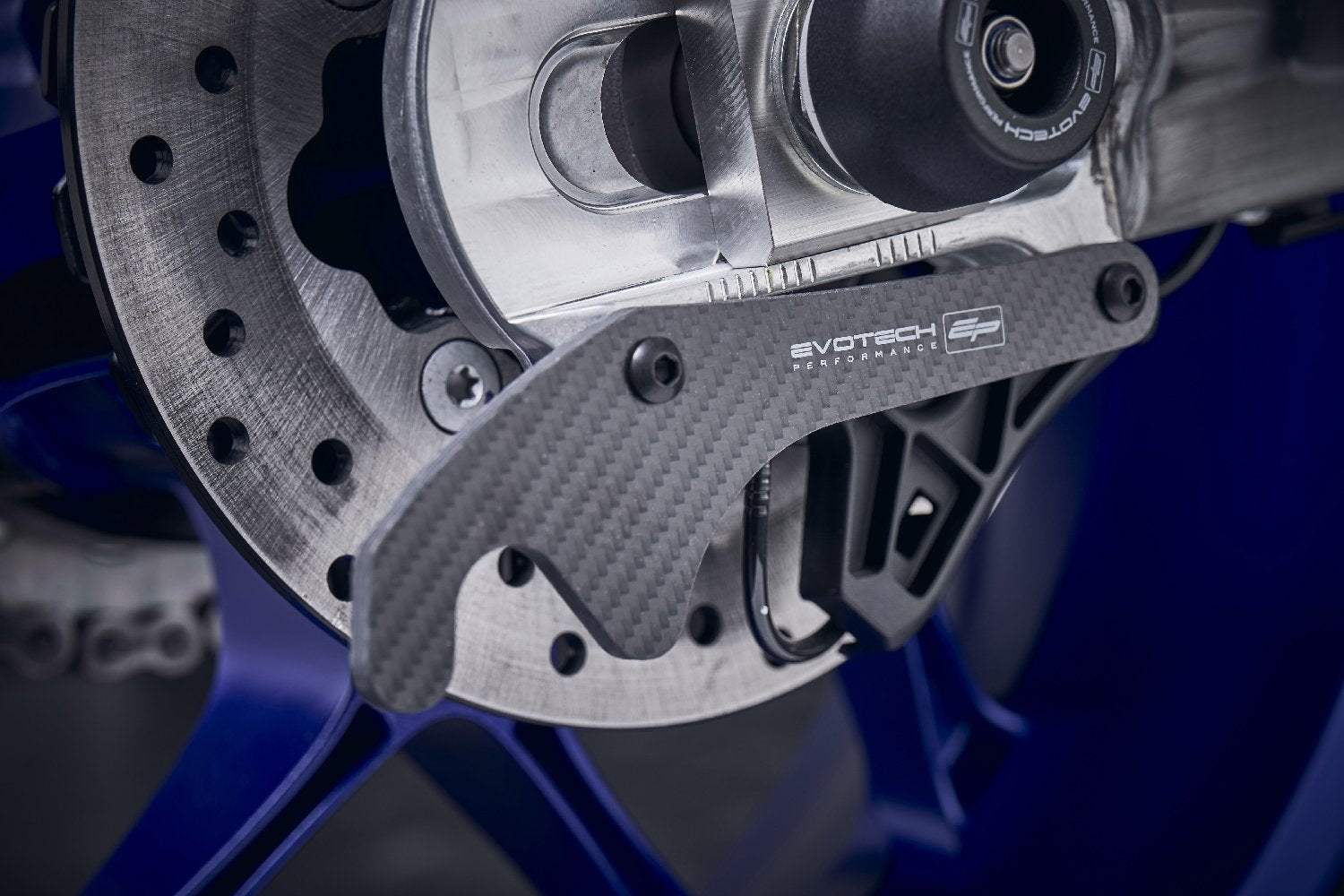 The rear swingarm of the Yamaha MT-10 with EP Carbon Fibre Paddock Stand Plates installed, ready to be attached to the paddock stand to elevate the rear wheel.