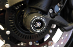 The injection-moulded nylon crash bung of EP Front Spindle Bobbins installed onto the front wheel of the KTM 1290 Super Adventure R, offering strong crash protection to the front forks and brake calipers.