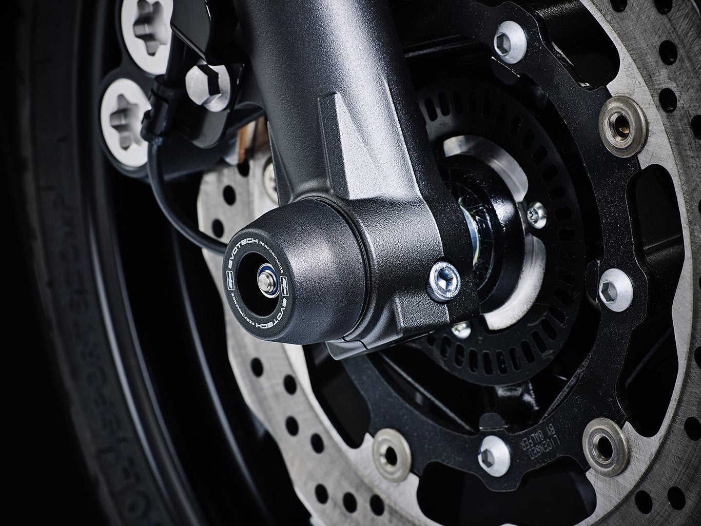 EP Front Spindle Bobbins crash protection from EP Spindle Bobbins Paddock Kit mounted to the front wheel of the Yamaha XSR700 XTribute.