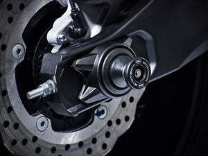 EP Paddock Stand Bobbins installed into the rear wheel of the Yamaha MT-07, one part of the EP Spindle Bobbins Paddock Kit. 